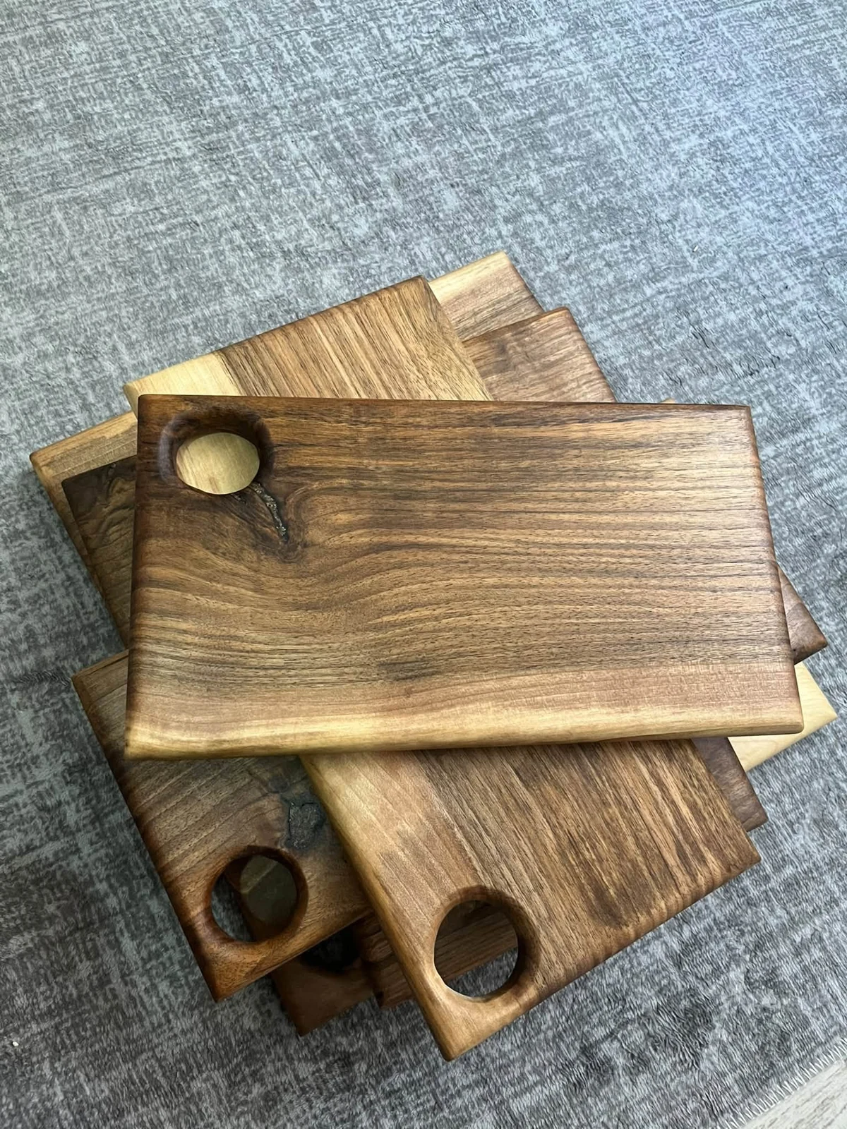 Original workshop reference photograph of the walnut cutting board with corner hole; one board supplied