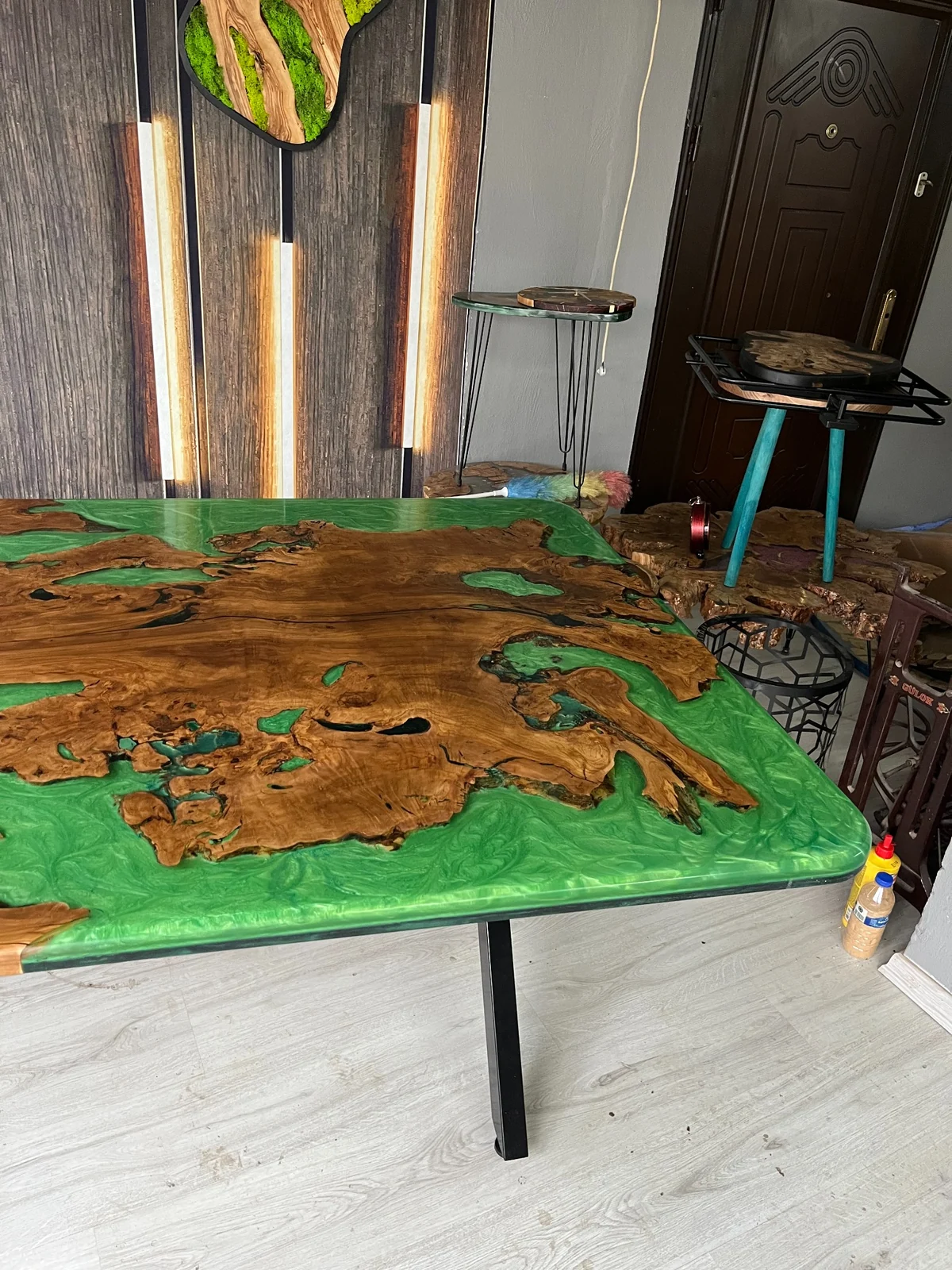 Green epoxy tabletop corner and black metal table leg