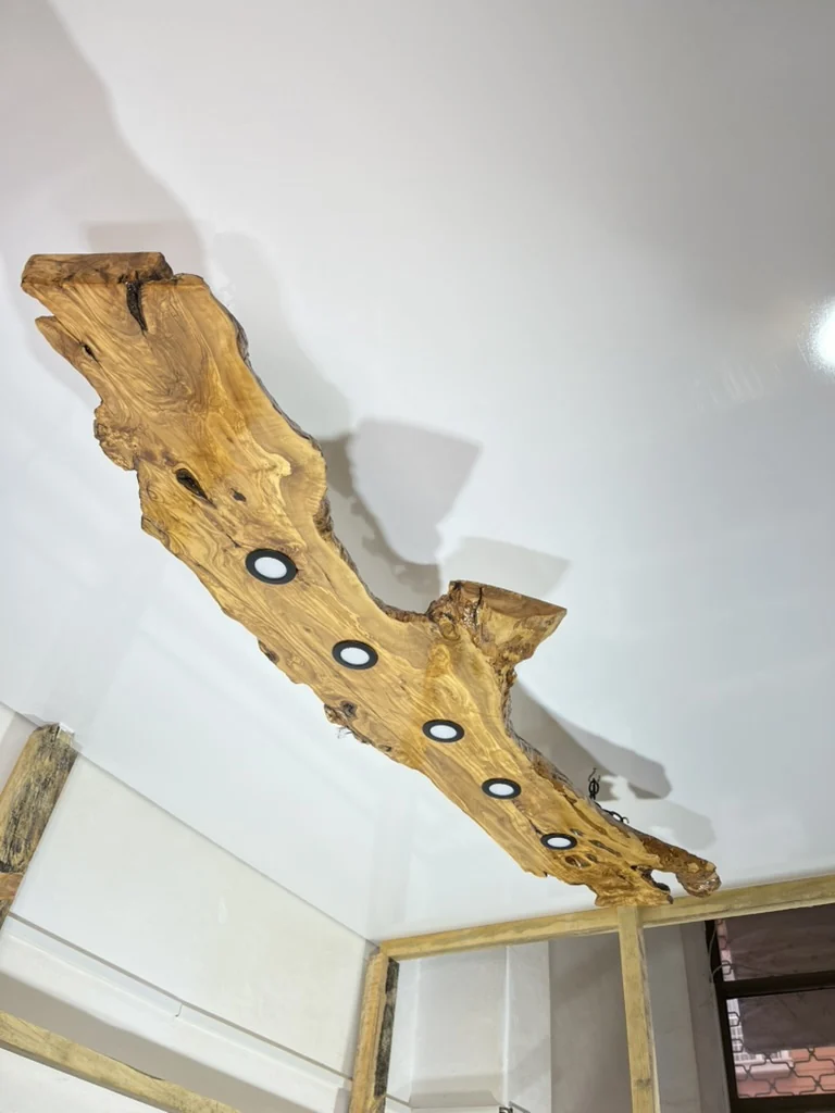 Original room view of the complete five-spot olive wood light fixture