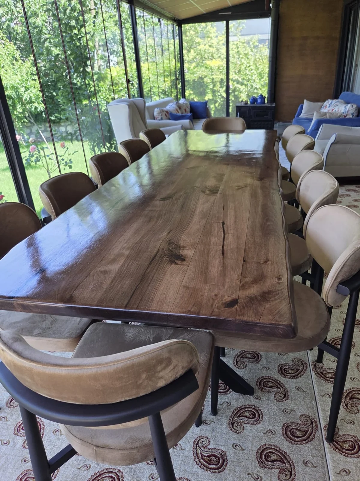 Detailed view of the finished walnut dining tabletop with natural knots and flowing grain