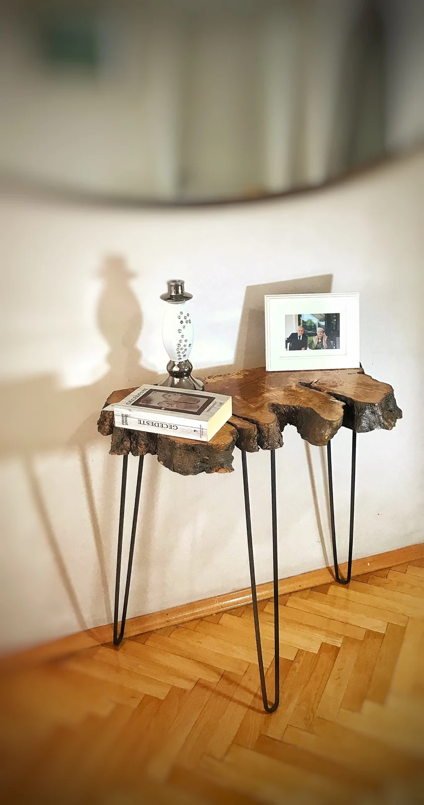 Olive wood entryway console table on slender black metal hairpin legs