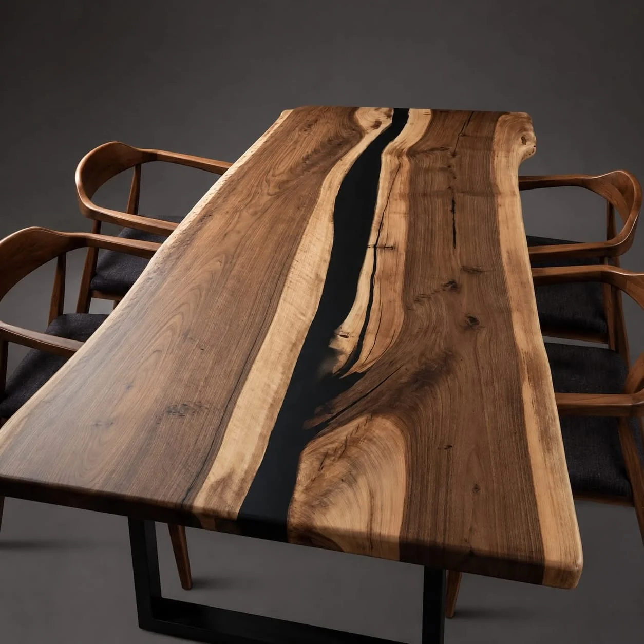 Close view of walnut grain and the black epoxy river on a dining tabletop
