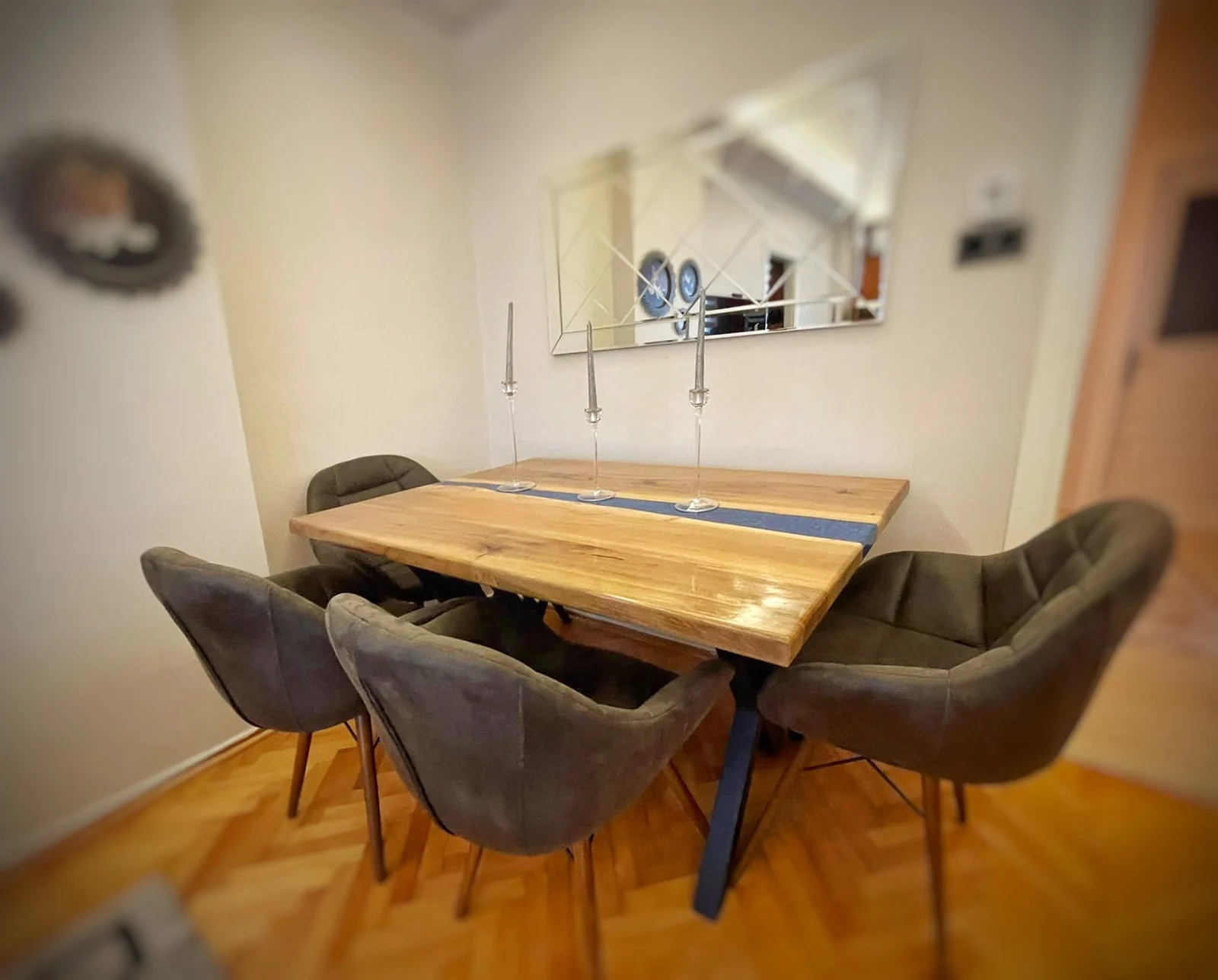 Original dining-room view of the wood and blue epoxy table